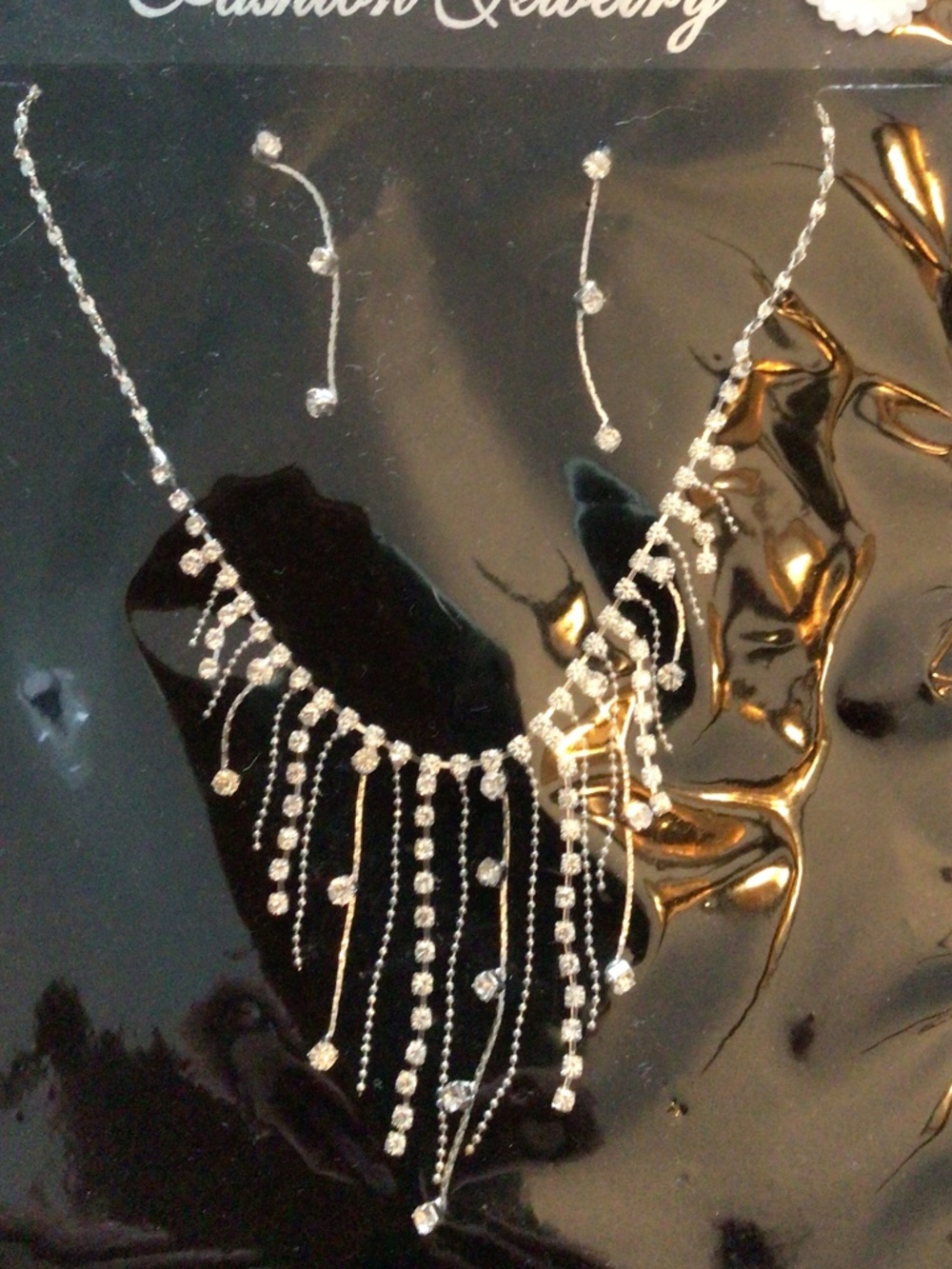 New in package dainty womenβs rhinestone necklace and pierced earring set